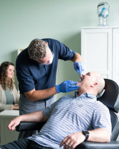 Dr. Canfield performing an exam on a patient